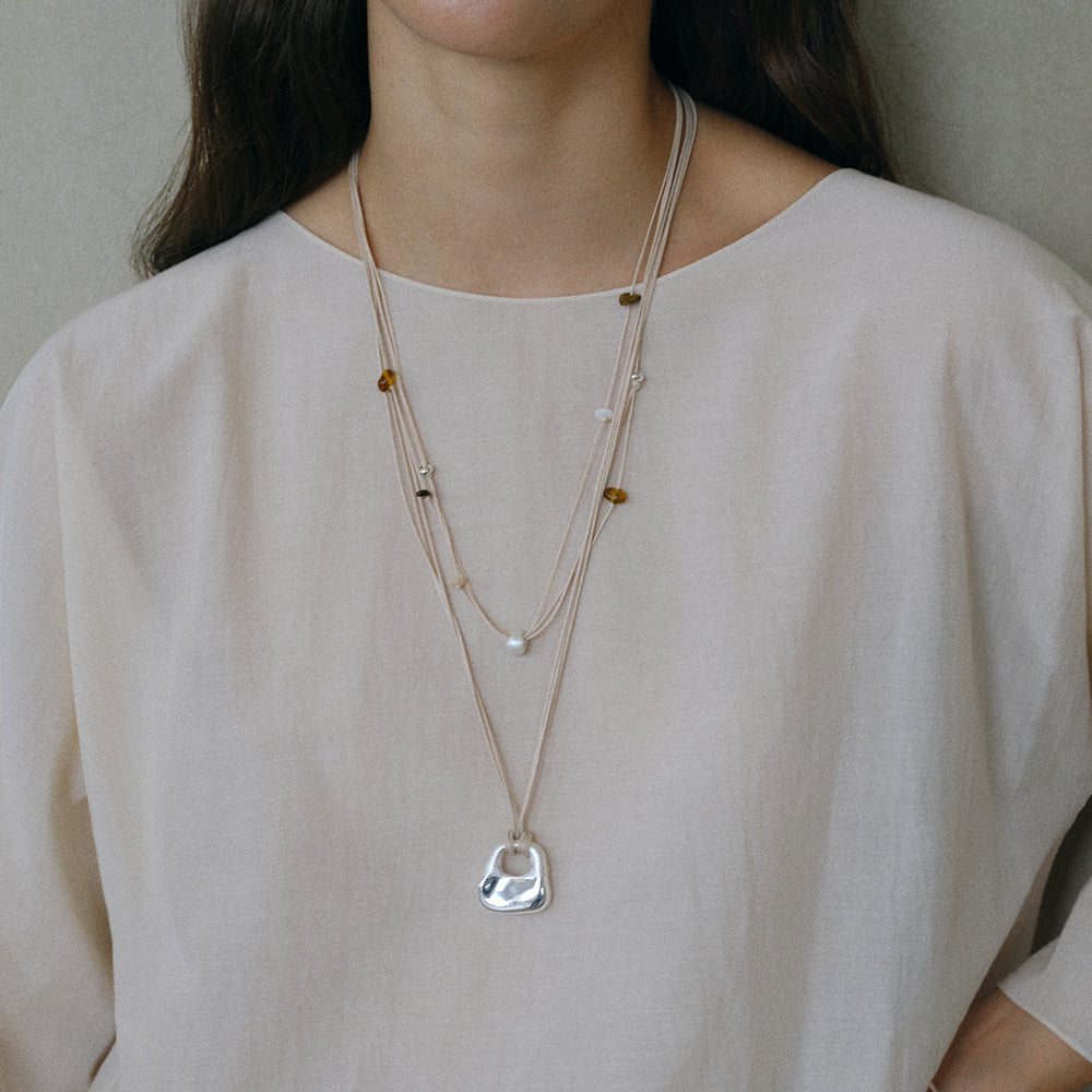 SILVER SILK EMBROIDERED LOCK POUCH NECKLACE